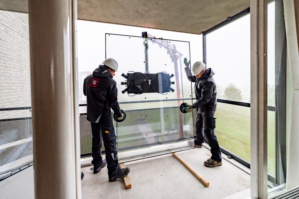 Glaszetters aan het werk fotografie